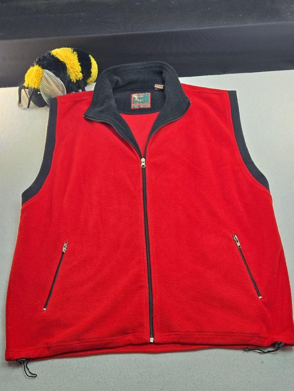 Red Cliff Trading Company fleece vest, styled in bright red